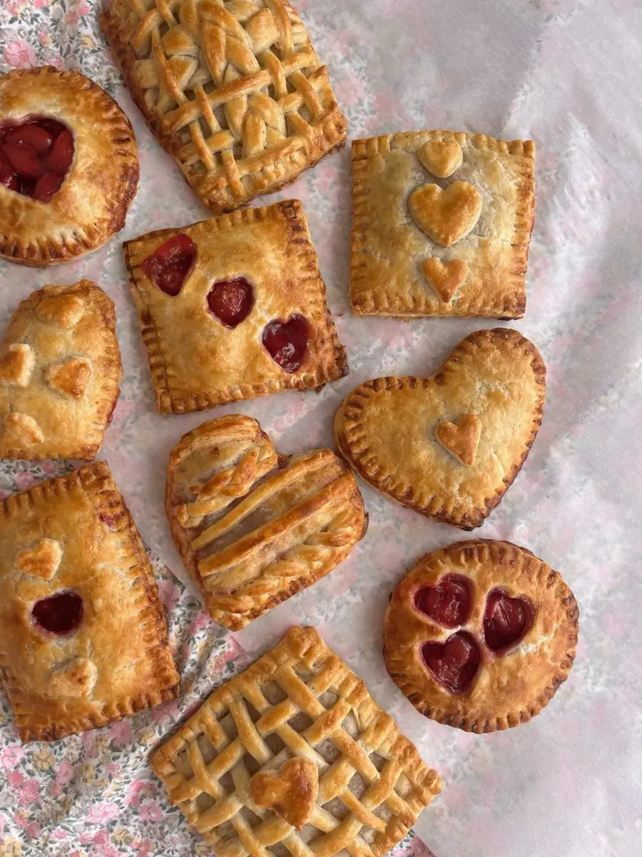 Assorted heart-shaped hand pies with lattice and cutout designs