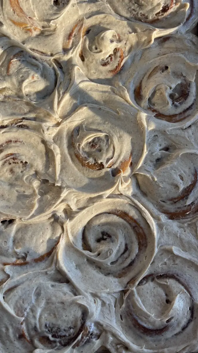 Frosted cinnamon rolls with swirled cream cheese icing