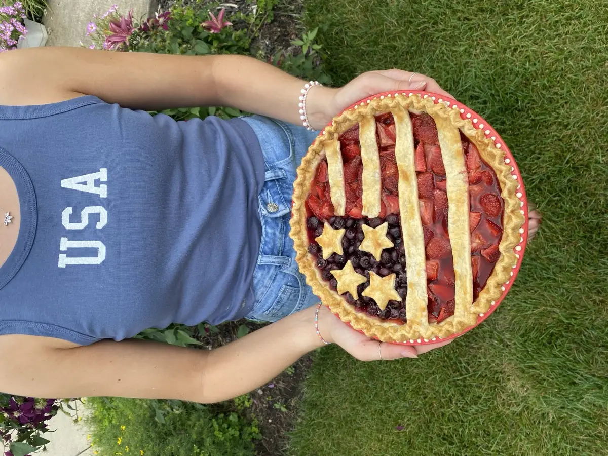 Fourth of July American flag pie with fresh strawberries and blueberries