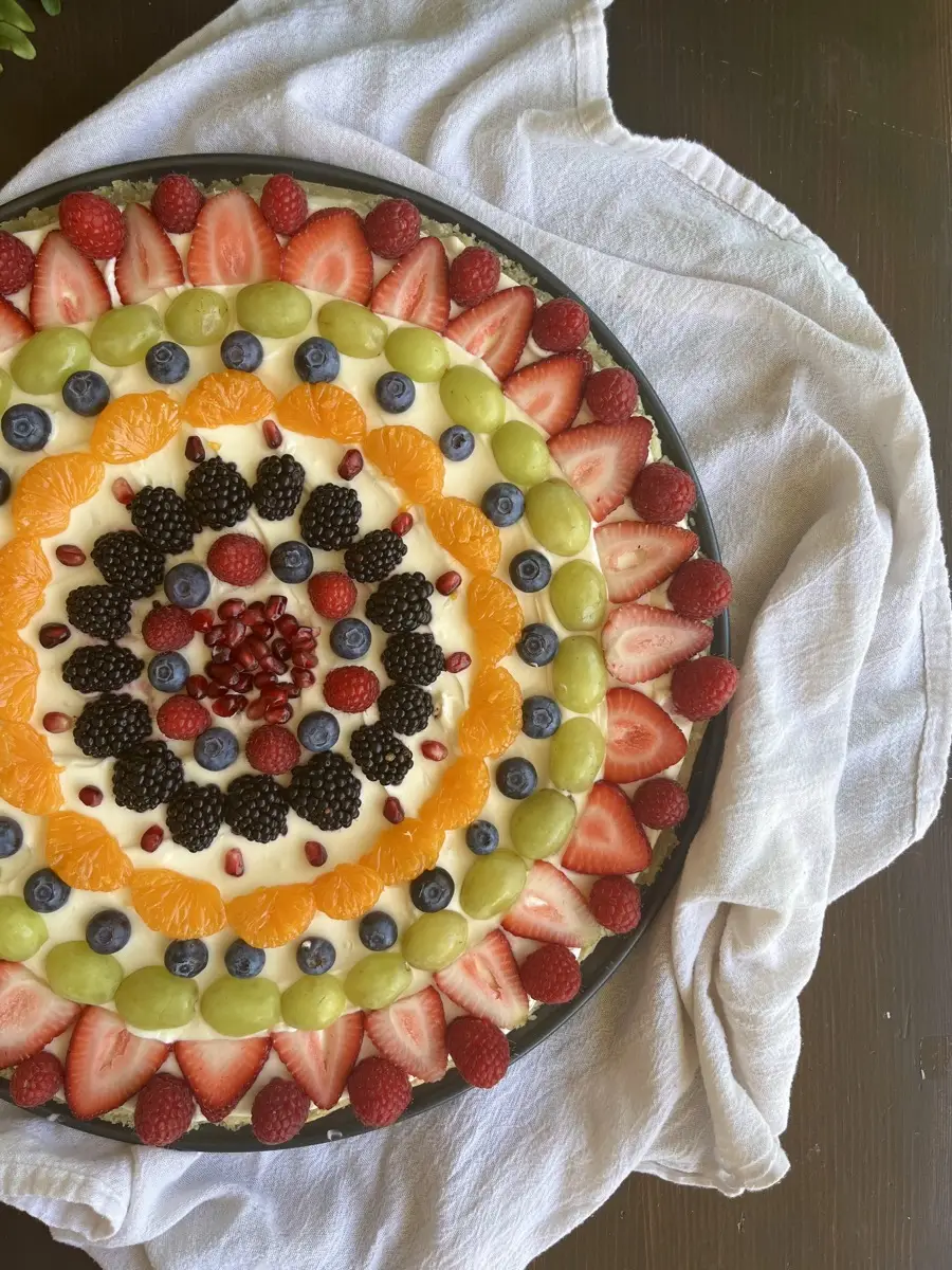 Stunning fruit tart with concentric rings of fresh berries, grapes, and citrus
