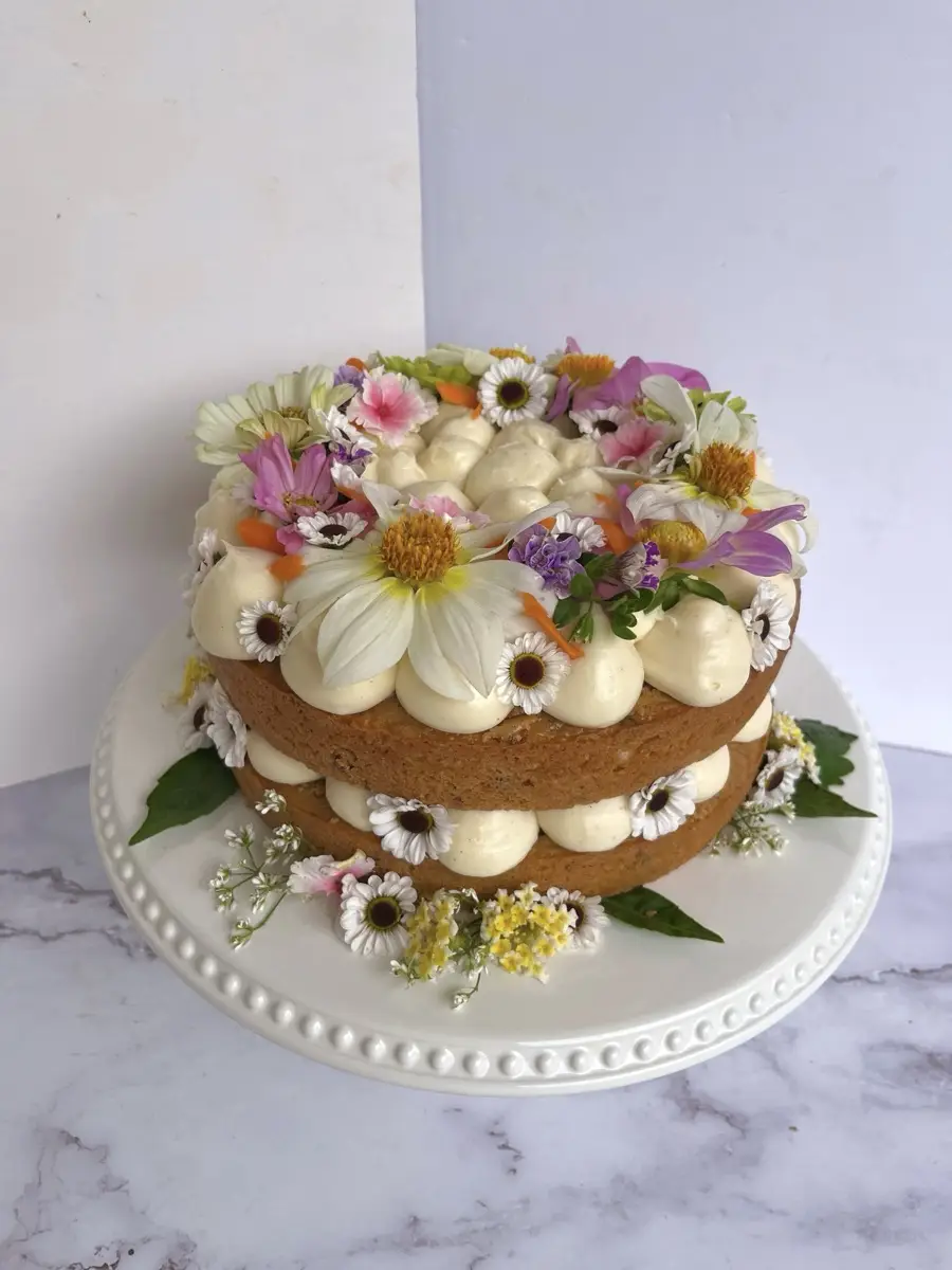 Vanilla bean cake crowned with colorful edible wildflowers